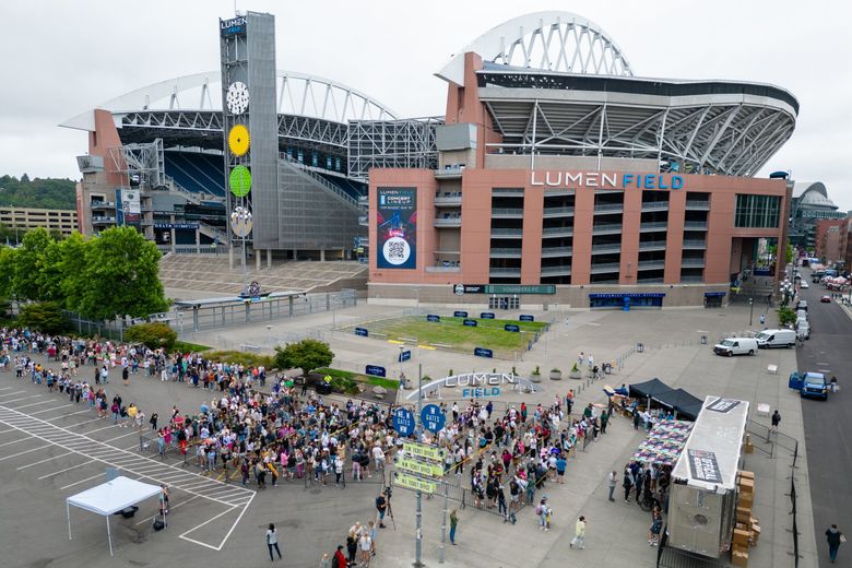 Die-hard Swifties wait in line hours for early merch sales at Lumen Field