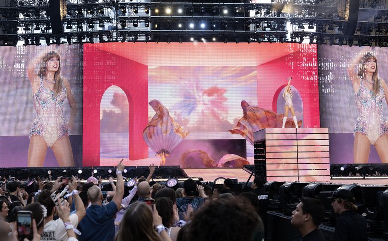 Elaborate set designs, outfit changes, inside jokes and more than 40 songs: Taylor Swift&#8217;s Eras Tour took over Lumen Field Saturday night in Seattle. (Luke Johnson / The Seattle Times)