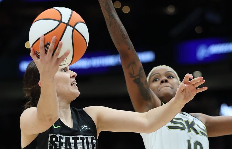 Seattle Storm guard Jade Melbourne makes a shot attempt with Chicago Sky guard Courtney Williams defending Saturday evening at Climate Pledge Arena in Seattle, Washington on July 22, 2023. The Storm are down 49-32 at the half. 224520