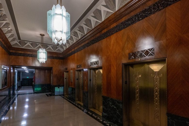 THE 1411 BUILDING: The Honduran mahogany lobby, polished-brass elevator doors and surrounds, and sandblasted glass fixtures were inspired by the French decorative arts vocabulary. (Kevin Clark / The Seattle Times)