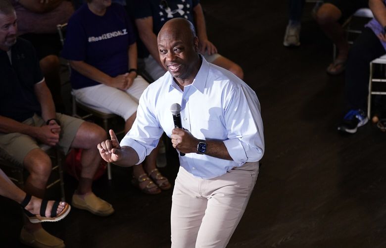 Republican presidential candidate Sen. Tim Scott, R-S.C., speaks during a town hall meeting, Thursday, July 27, 2023, in Ankeny, Iowa. (AP Photo/Charlie Neibergall) WX204 WX204