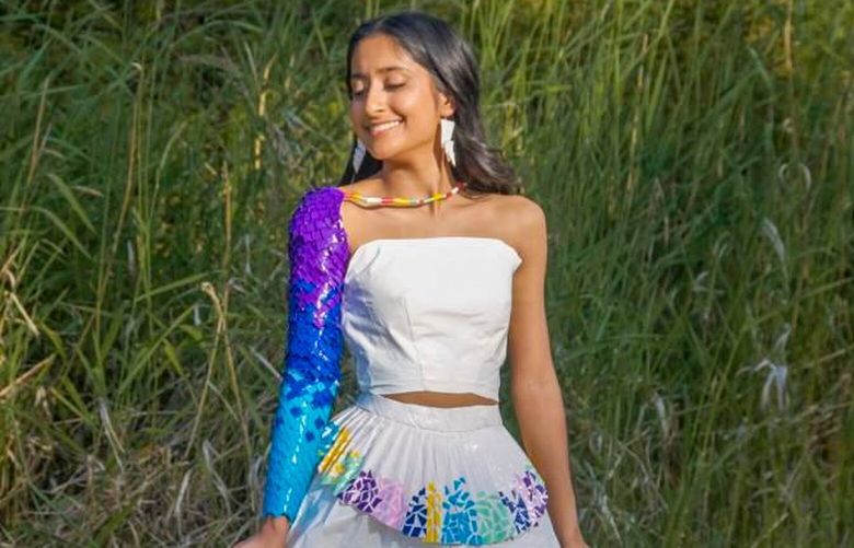 Sammamish resident Neha Nanubhai models a dress that she designed and made from duct tape, earning her a runner-up award in the national Stuck At Prom Scholarship Contest presented by Duck brand duct tape.