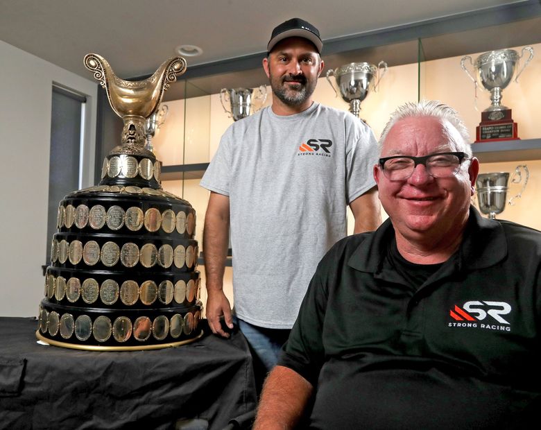 Strong Racing owner Darrell Strong with driver Cory Peabody, left, with the Gold Cup they won last year in Guntersville, Ala. (Greg Gilbert / The Seattle Times)