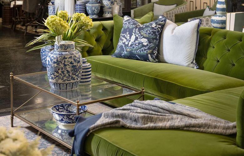 This rich velvet green sofa is the star of this elegant and timeless living room. (TNS)