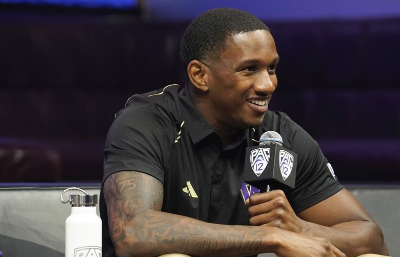 Washington quarterback Michael Penix Jr. smiles at the Pac-12 NCAA college football media day, Friday, July 21, 2023, in Las Vegas. (AP Photo/Lucas Peltier) NVLP141 NVLP141