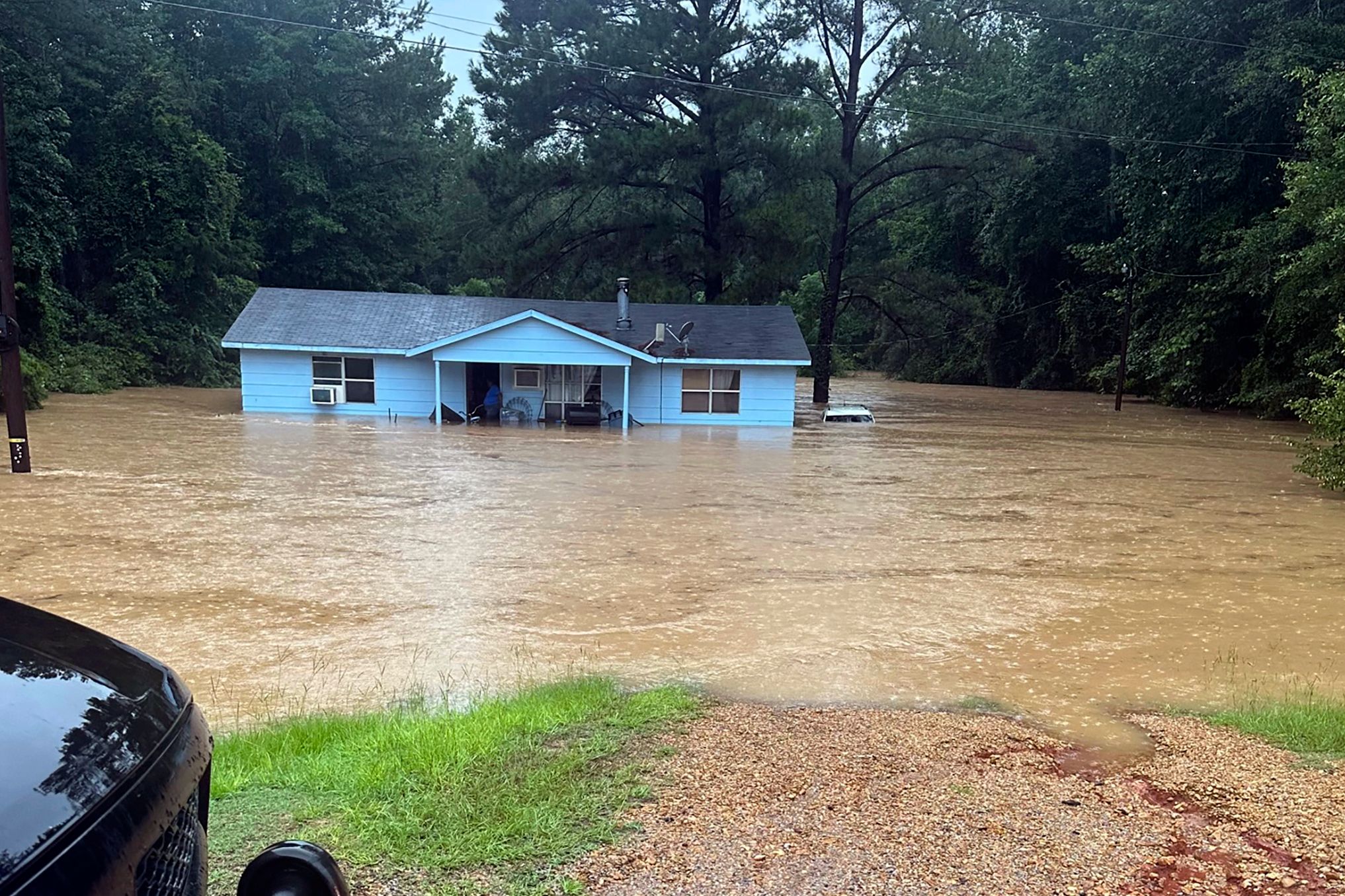 People rescued from cars and homes as torrential rain causes flash