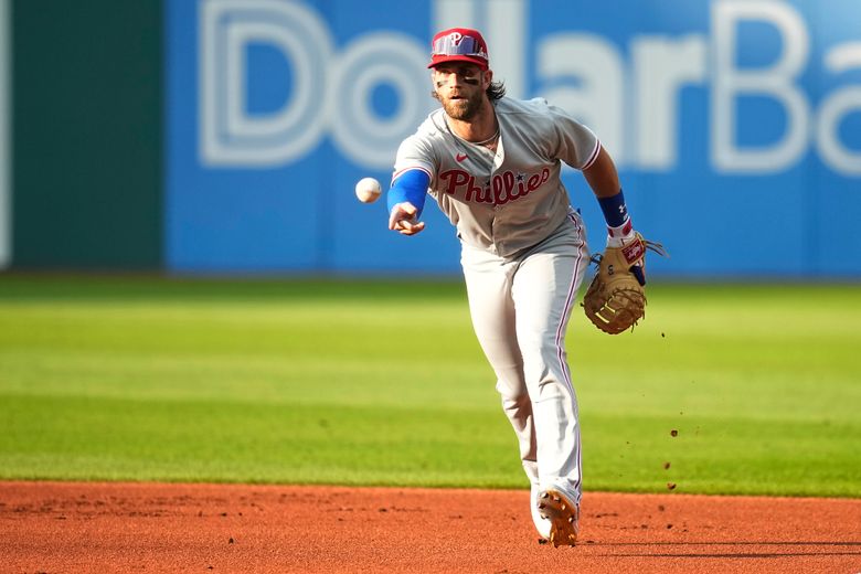 Phillies star Bryce Harper makes catch tumbling into photo pit in first  career start at first base