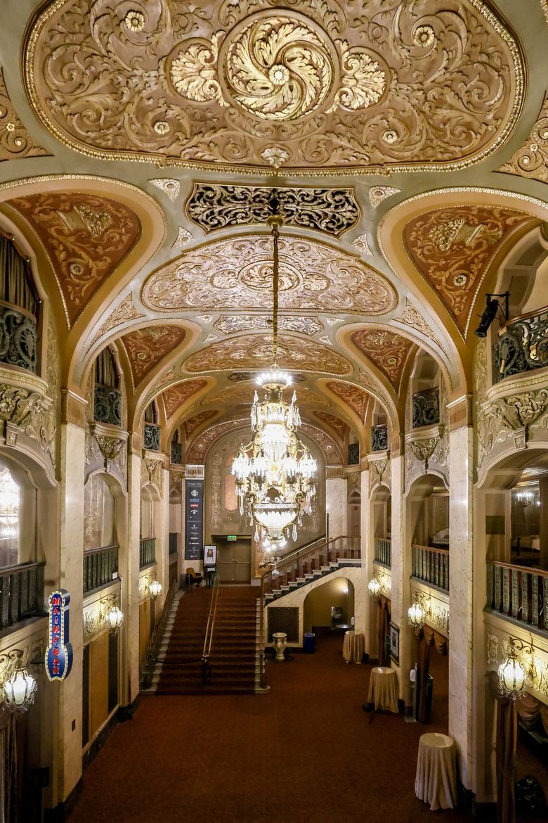 THE PARAMOUNT THEATRE: A progression of spaces leads from the box office to the colonnaded foyer and into a grand hall, with magnificent bronze and crystal chandeliers overhead and three tiers of lobbies. (Kevin Clark / The Seattle Times)