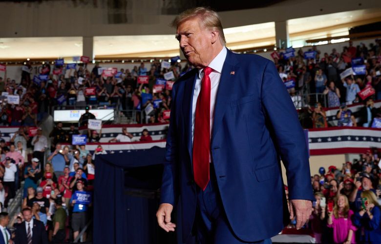 Former president Donald Trump makes his way to the stage during a rally in Erie, Pa., on Saturday. MUST CREDIT: Photo for The Washington Post by Dustin Franz