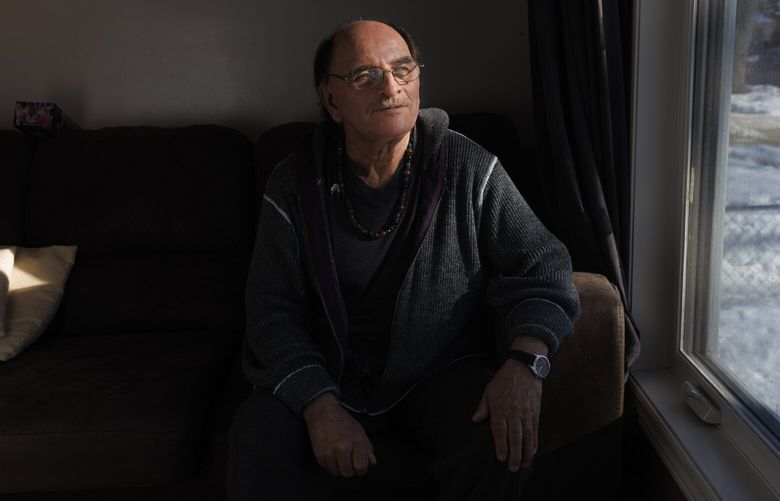 Eddy Ambrose, who at age 65 discovered that he’d been switched at birth in a rural Canadian hospital, at home in Winnipeg, Manitoba, Canada on March 6, 2023. The revelation has forced Ambrose and Richard Beauvais, who was raised by Ambrose’s biological grandparents, to question who they really are, each trying to piece together a past that could have been his and to understand the implications of it. (Nasuna Stuart-Ulin/The New York Times) XNYT0200 XNYT0200