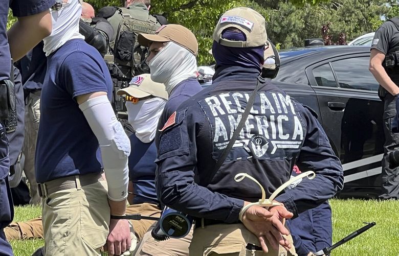 Authorities arrest members of the white supremacist group Patriot Front near an Idaho pride event Saturday, June 11, 2022, after they were found packed into the back of a U-Haul truck with riot gear. (Georji Brown via AP) LA613 LA613 LA613