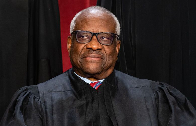 Associate Justice Clarence Thomas during the formal group photograph at the Supreme Court in Washington, DC, US, on Friday, Oct. 7, 2022. The court opened its new term Monday with a calendar already full of high-profile clashes, including two cases that could end the use of race in college admissions. Photographer: Eric Lee/Bloomberg
