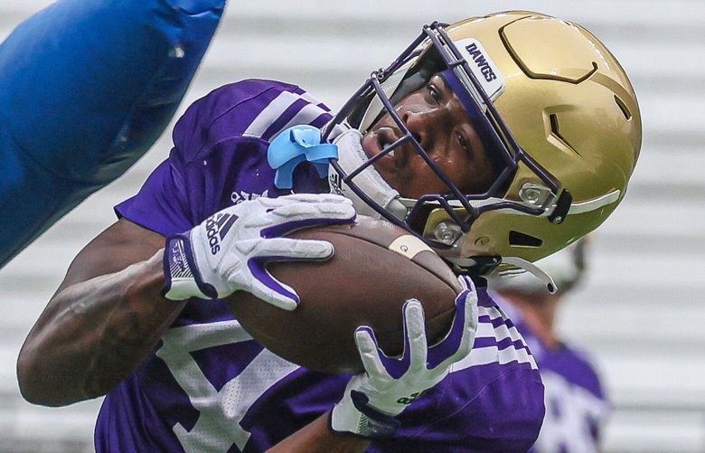 Washington Huskies Germie Bernard makes a catch Saturday morning at Huskies Stadium in Seattle, Washington on August 5, 2023. 224570