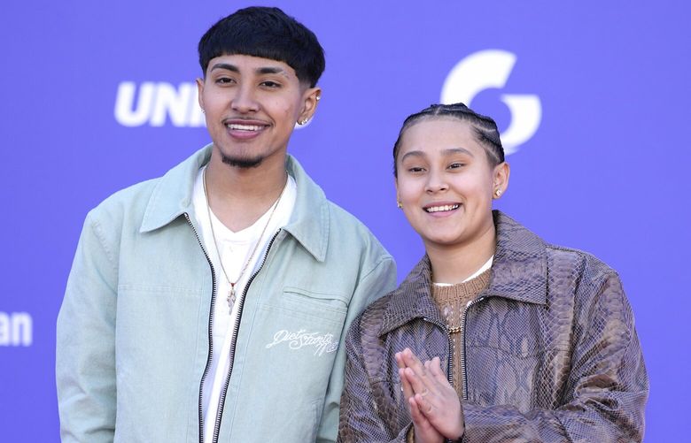 Jairo Martinez, left, and Yahritza Martinez of Yahritza y Su Esencia arrive at the Latin American Music Awards on Thursday, April 20, 2023, at the MGM Grand Garden Arena in Las Vegas. (AP Photo/John Locher) NVDA523