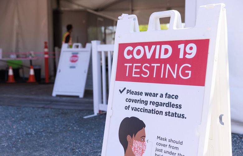Grant Natzke, medical assistant lead, works at the University of Washington COVID-19 testing location at 4113 Franklin Pl NE in Seattle Wednesday, May 10, 2023. 
 223812