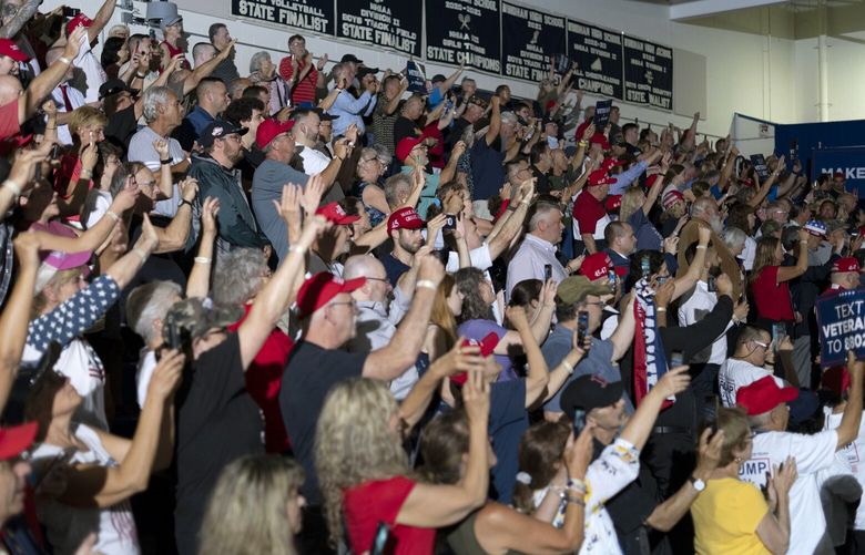Attendees cheer as Former President Donald Trump speaks at a campaign rally at Windham High School in Windham, N.H., on Tuesday, Aug. 8, 2023. The former president, who has made his 2024 campaign principally about his own personal grievances, is attempting to convince supporters to see themselves in him. (David Degner / New York Times) XNYT0441 XNYT0441