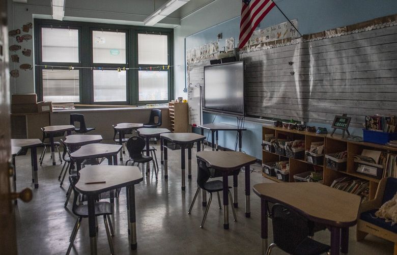 FILE – An empty elementary school classroom is seen on Tuesday, Aug. 17, 2021 in the Bronx borough of New York. Nationwide, students have been absent at record rates since schools reopened after COVID-forced closures. More than a quarter of students missed at least 10% of the 2021-22 school year. (AP Photo/Brittainy Newman, File) NY885 NY885