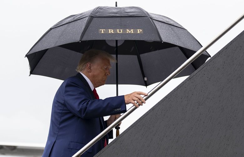 FILE — Former President Donald Trump departs Reagan National Airport after his arraignment in federal court in Washington on Thursday, Aug. 3, 2023. Two prominent conservative law professors have concluded that Trump is ineligible to be president under a provision of the Constitution that bars people who have engaged in an insurrection from holding government office. (Doug Mills/The New York Times)
 XNYT0792 XNYT0792