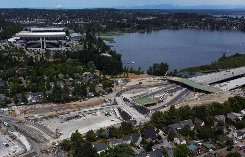 The massive 520 bridge lid project is seen from the air in this view looking north, Sunday, July 16, 2023 in Seattle. Montlake Boulevard, at left, which is closed until July 24, usually carries more than 60,000 drivers a day.