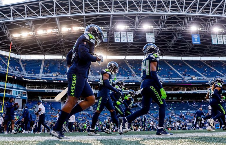 The Seattle Seahawks warm-up before the start of the first preseason game against the Minnesota Vikings. 224646
