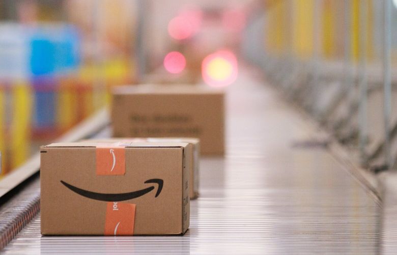 Packages travel on conveyor belts inside Amazon’s Kent fulfillment center Friday, July 22, 2022. 221047