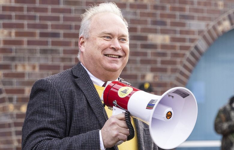 Republican Washington Rep. Jim Walsh speaks to protesters outside Department of Health offices in Tumwater as many gathered against the state Board of Health with false claims that the board is passing rules to involuntarily quarantine COVID-19 vaccine refusers, on Wednesday, Jan. 12, 2022. Congressional republican candidate Joe Kent was a speak and also in attendance. 

About 200 protesters showed up to express anger at the nonexistent and false quarantine plot, as well as a real — but very early stage — study of whether to mandate COVID-19 vaccines for children to attend K-12 schools.
