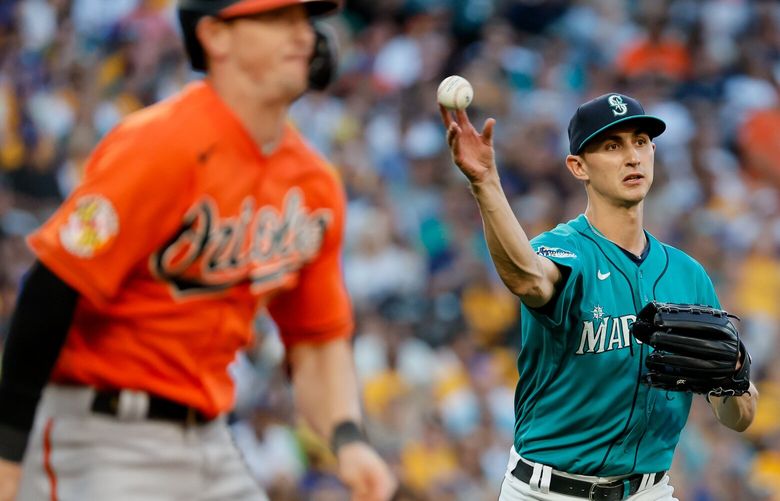 Seattle Mariners starting pitcher George Kirby throws to first for the out on Baltimore Orioles left fielder Austin Hays to end the top of the fifth inning. 224676
