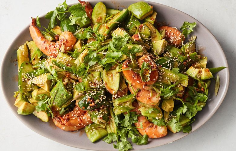 Smashed cucumber, avocado and shrimp salad. Crushed until craggy and tossed with shrimp, cucumbers soak up a sesame and avocado sauce in this easy, invigorating dish from Melissa Clark. Food styled by Rebecca Jurkevich. (Johnny Miller/The New York Times) XNYT0518