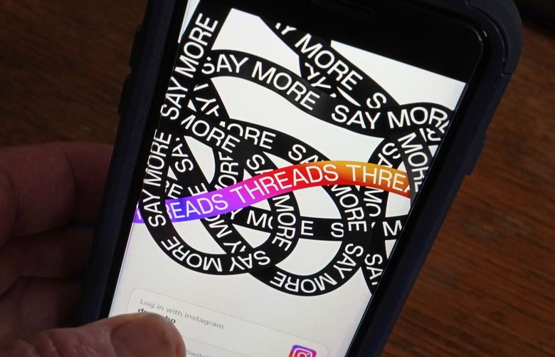 Meta’s new app Threads.  As of Aug. 7, the number of people who used Threads daily hovered around 10 million on Android phones, down from 49 million when it launched a month earlier, according to research firm SimilarWeb.  (AP Photo/Richard Drew) 