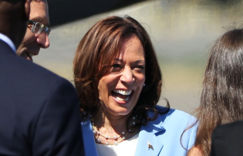 U.S. Vice President Kamala Harris greets Washington state  Attorney General Bob Ferguson, left, and his daughter, Katie, right, at Boeing Field in Seattle on Tuesday, August 15, 2023. She is expected to deliver remarks later in the day about the Inflation Reduction Act (IRA) being signed into law.
