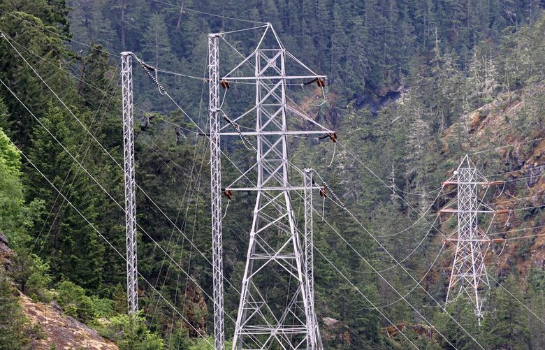Transmission lines and towers are seen in the vicinity of Ross Dam in the North Cascades in Whatcom County on Wednesday, May 24, 2023. The Seattle City Light  Hydroelectric Project consists of three dams on the Skagit River that supplies some power to the city of Seattle.