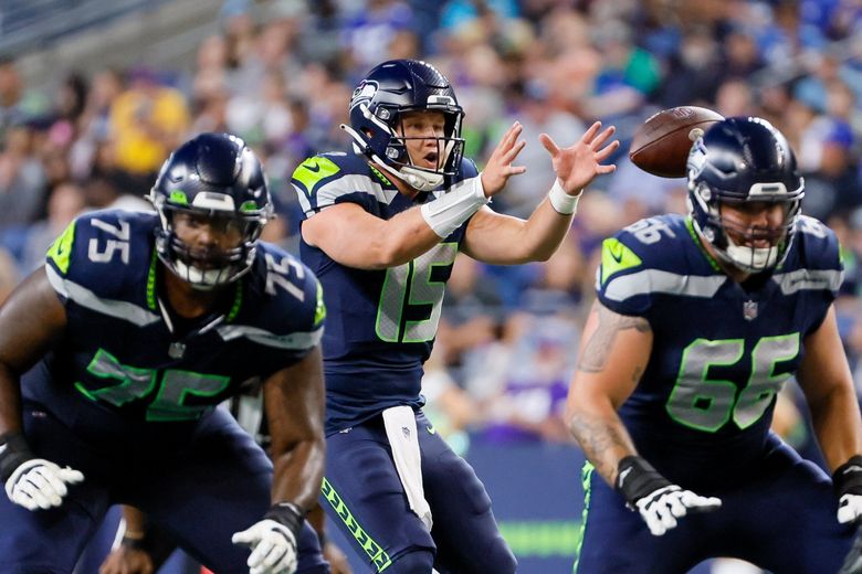 Seattle Seahawks quarterback Holton Ahlers looks to pass against