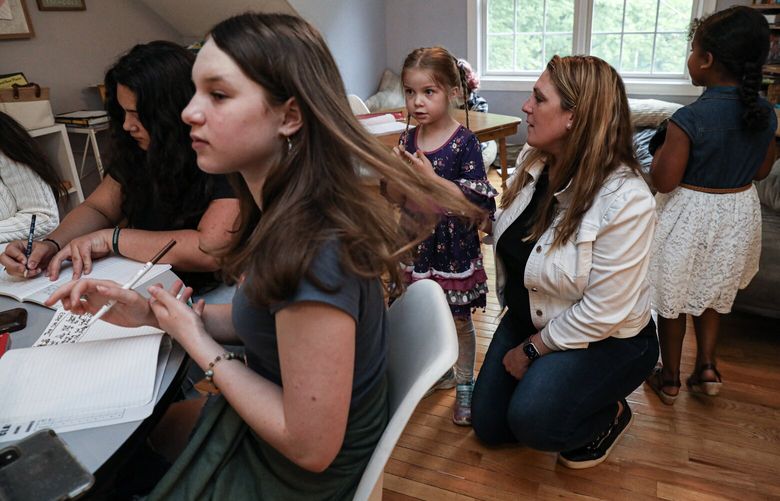 Katy Rose works with students at her home-based microschool in Goffstown, N.H. MUST CREDIT: Photo for The Washington Post by Cheryl Senter