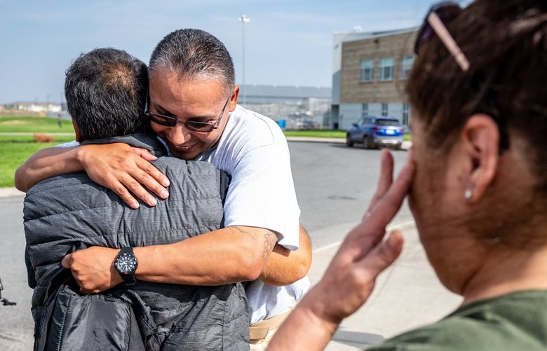 Evaristo Salas, 42, is greeted by father Ruben Alvarado and family as he walks out of the Airway Heights Corrections Center in Spokane County a free man, Thursday, August 17, 2023. Salas, who has spent 26 years in prison, had his murder charge dismissed in a 1995 Sunnyside homicide case he said he did not commit.