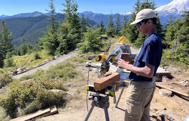 Darren Baptiste performs woodwork for the ramp to Suntop Lookout in Mount Baker–Snoqualmie National Forest on Aug. 11, 2023.
