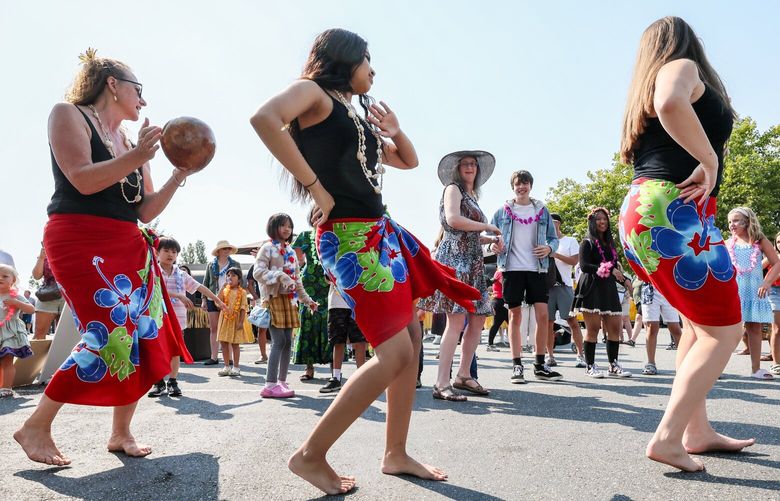 Instructors from Sunshine for Polynesia lead a hula lesson Saturday afternoon during the Lynnwood Luau at the Lynnwood Event Center in Lynnwood, Washington on August 19, 2023.