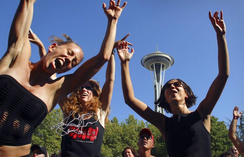 090504 Bumbershoot:  Fans leave their feet as the band Quasi Nada lifts them with the beat in the sunshine at Bumbershoot.

NWSource request approved 9/1/05 TN