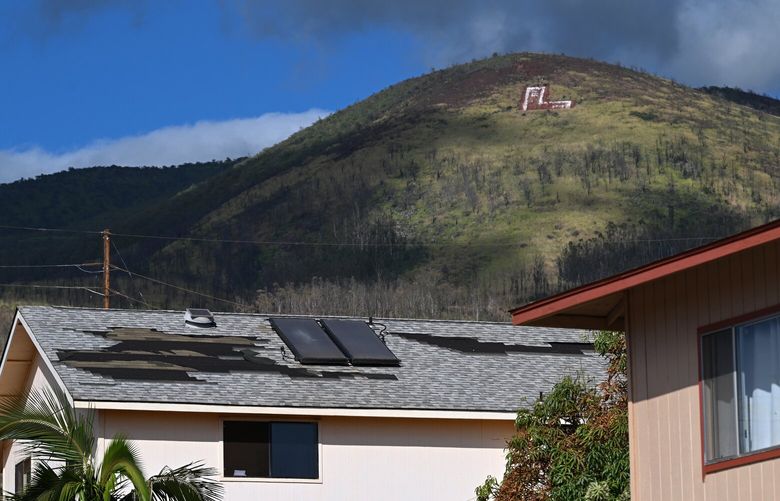 Shingles are missing from a roof in Lahaina after the wildfires that started Aug. 8. MUST CREDIT: Washington Post photo by Matt McClain.