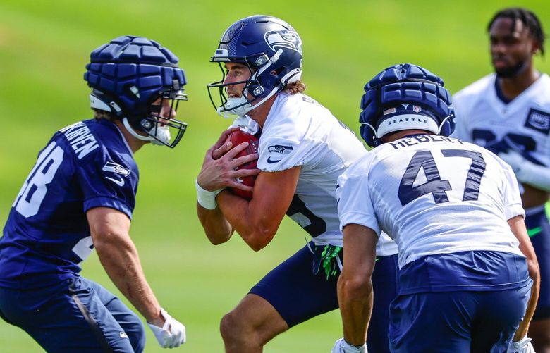 Jake Bobo (center) fields kicks during practice Tuesday. 224770