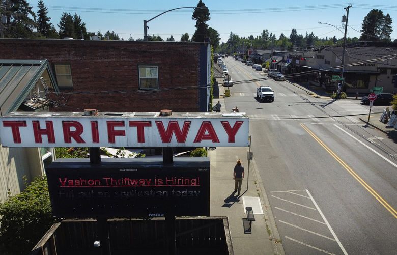 The main drag on Vashon Island, Tuesday, Aug. 15, 2023 includes a message that Thriftway is hiring.  Meanwhile, affordable housing on the island remains a challenge here for both employees and employers.