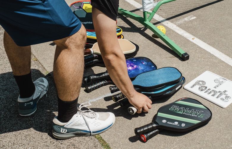 Pickleball players in Central Park in New York, June 17, 2023. Pickleball is everywhere, and “Paddleball Paul” is making his last stand on the handball courts of Central Park. It’s not going very well. (Lanna Apisukh/The New York Times)