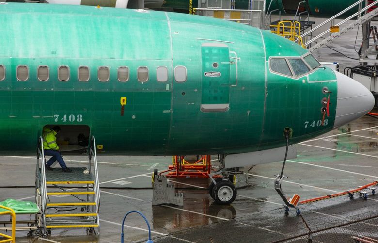 An employee works on a 737 Max 8 plane destined for China Southern Airlines at the Boeing Co. manufacturing facility in Renton, Washington, U.S., on Tuesday, Mar. 12, 2019. The Boeing 737 Max crash in Ethiopia looks increasingly likely to hit the planemaker’s order book as mounting safety concerns prompt airlines to reconsider purchases worth about $55 billion. Photographer: David Ryder/Bloomberg 775314939