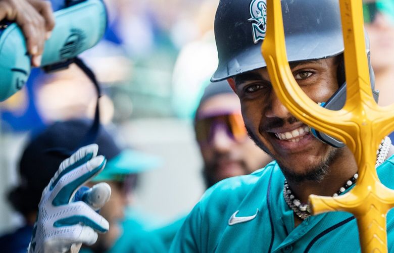 Mariners center fielder Julio Rodríguez celebrates after hitting a two-run home run Saturday, Aug. 26, 2023, as the Mariners take on the Royals at T-Mobile Park in Seattle.