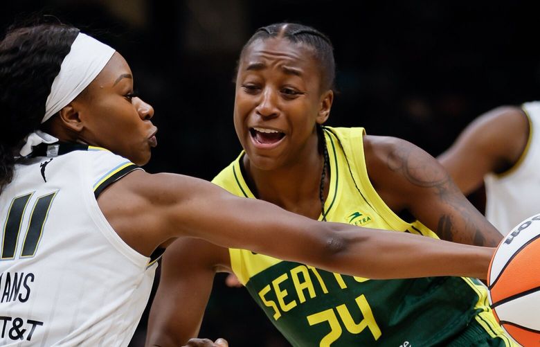 Chicago Sky guard Dana Evans pokes the ball away from Seattle Storm guard Jewell Loyd during the fourth quarter. 224833