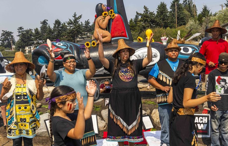 Lummi Nation community members dance and sing songs, celebrating the life of Tokitae the orca at Jackson Beach Park on San Juan Island on Sunday, Aug. 27, 2023. Tokitae, the last of the southern resident orcas still alive in captivity until August 18, when she passed after 53 years in the same tank at the Miami Seaquarium.