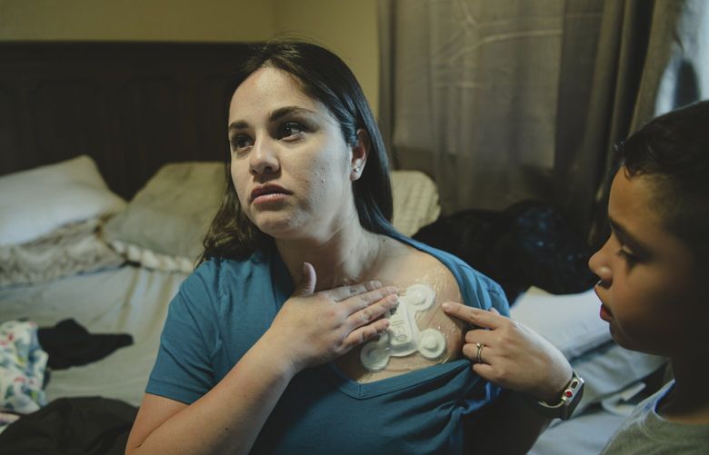 Marlene Rodr’guez, right, who required two months on an ECMO machine after he contracted COVID-19 in Dec. 2020, with her 2-year-old daughter, Vianney, in Atwater, Calif., on April 14, 2023. More than three years after the start of the pandemic, many COVID-19 survivors continue to struggle; some, especially those who became so severely ill that they were hospitalized and unable to breathe on their own, face lasting lung damage. (Meridith Kohut/The New York Times) XNYT0457 XNYT0457