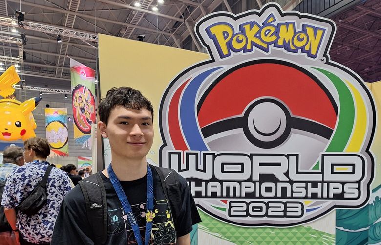 In between Pokémon GO battles, University of Washington sophomore Thomas Welch poses in front of the sign for the 2023 Pokémon World Championships in Yokohama, Japan. (Courtesy of the Welch family)