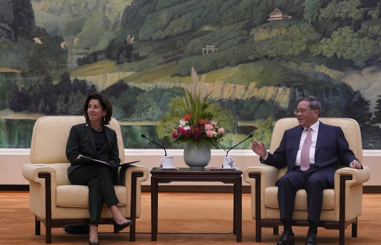Chinese Premier Li Qiang, right, talks to U.S. Commerce Secretary Gina Raimondo during a meeting at the Great Hall of the People in Beijing, Tuesday, Aug. 29, 2023. (AP Photo/Andy Wong, Pool) XAW122 XAW122