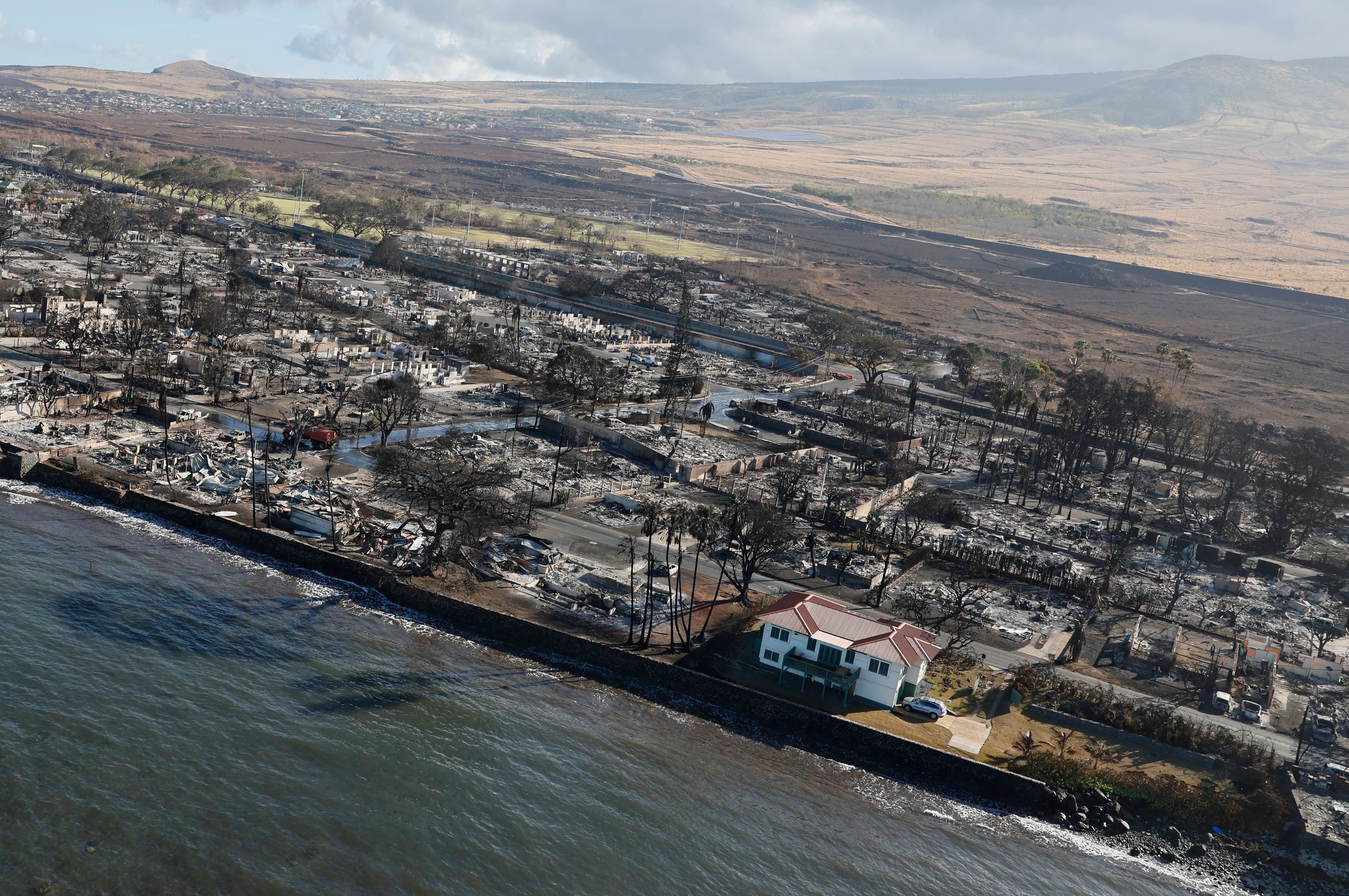 The real story behind that photo of a weirdly unscathed house in