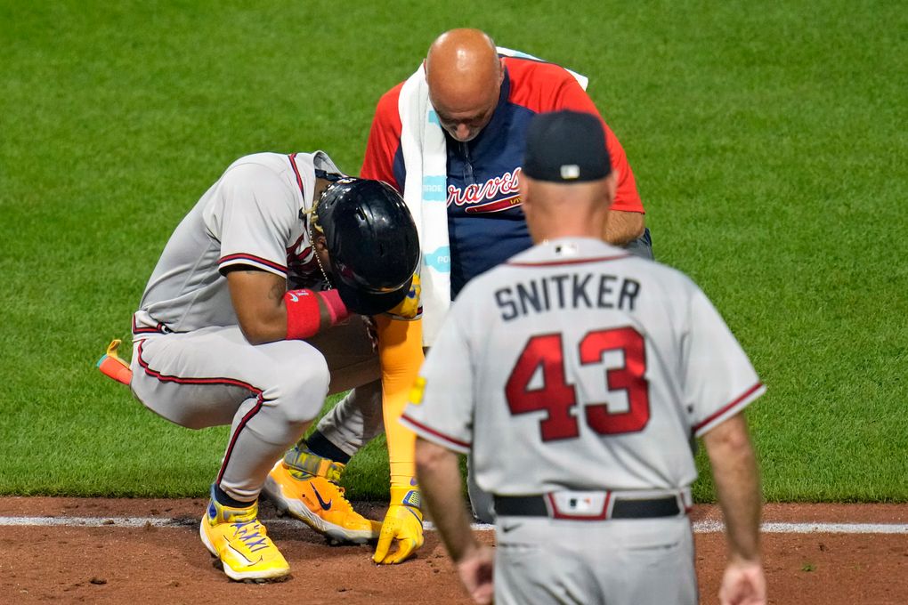 Braves' Ronald Acuña Jr. hit on the left elbow by a pitch, leaves game; X-rays negative | The Seattle Times